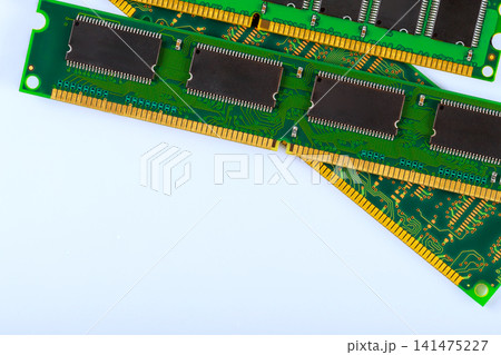 Several computer memory modules are placed RAM modules with green circuit boards integrated chips used for upgrades data processing Several computer memory modules are placed RAM modules with green circuit boards integrated chips used for upgrades data processing 141475227