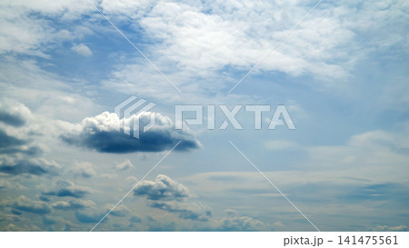 contrasting dark cloud against a light sky background contrasting dark cloud against a light sky background 141475561