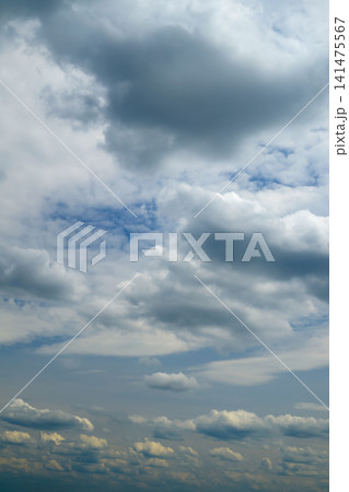 dark storm and light clouds in a vertical sky frame dark storm and light clouds in a vertical sky frame 141475567