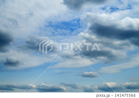 cumulus dark clouds against blue sky cumulus dark clouds against blue sky 141475568