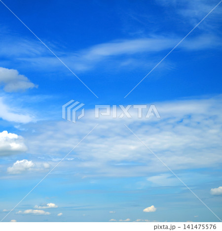 stratus and cumulus clouds against a bright blue background of the summer sky stratus and cumulus clouds against a bright blue background of the summer sky 141475576