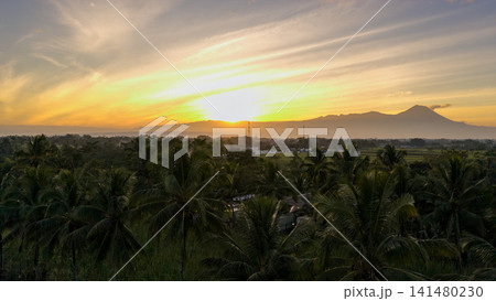 Beautiful sunrise landscape over mountain silhouette with colorful morning sky and tropical trees Beautiful sunrise landscape over mountain silhouette with colorful morning sky and tropical trees 141480230