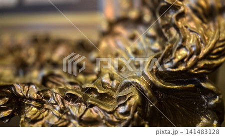 Abstract close up of ornate gold metal texture Abstract close up of ornate gold metal texture 141483128