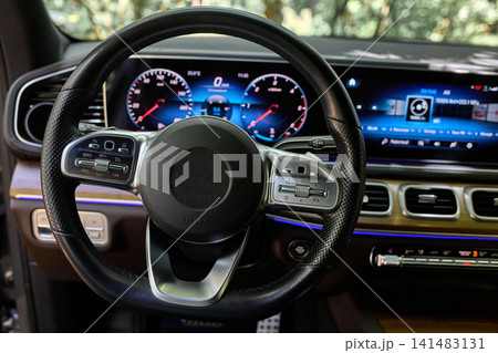 Luxury car interior with digital dashboard and steering wheel 141483131