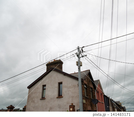 Residential houses beneath overhead utility lines 141483171