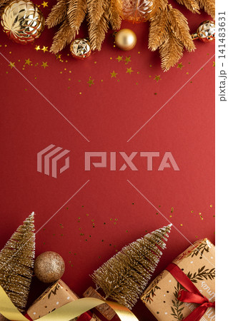 Christmas holiday background with golden ornaments and gifts Christmas holiday background with golden ornaments and gifts 141483631