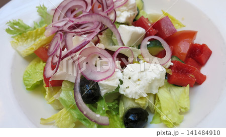 Close View of a Fresh Greek Salad in a White Bowl Close View of a Fresh Greek Salad in a White Bowl 141484910