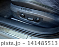 Luxury car seat adjustment controls close up 141485513