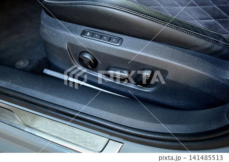 Luxury car seat adjustment controls close up Luxury car seat adjustment controls close up 141485513