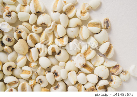 Raw Job's Tears Grains on White Background Raw Job's Tears Grains on White Background 141485673