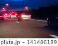 Night Traffic Congestion on Highway With Cars and Tail Lights During Rush Hour Commute 141486189