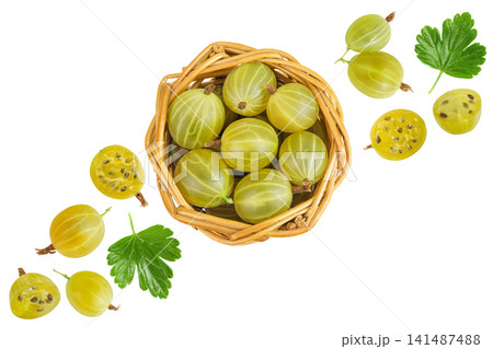 Green gooseberry in a wicker basket isolated on white background. Top view. Flat lay. Green gooseberry in a wicker basket isolated on white background. Top view. Flat lay. 141487488