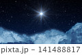 Glowing Star or Christmas Star over the Clouds Shines Brightly in the Starry Night Sky. 141488817