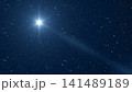 A bright star with rays in the starry sky 141489189
