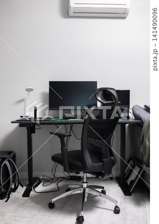 Minimalist home office with desk, monitor, laptop, ergonomic chair and office equipment, creating a clean and functional workspace for remote work, study and everyday productivity Minimalist home office with desk, monitor, laptop, ergonomic chair and office equipment, creating a clean and functional workspace for remote work, study and everyday productivity 141490096