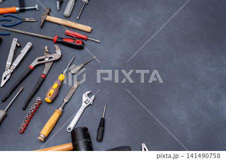 Assortment of Hand instruments Tools on Dark Background 141490758