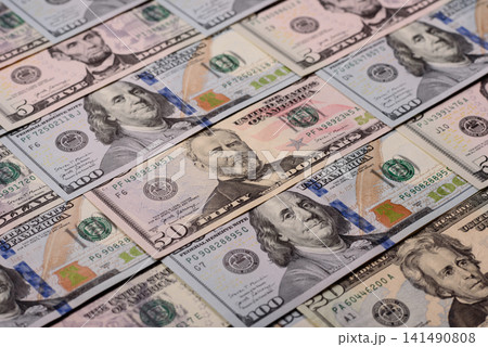 Paper US dollar bills of various denominations and cent coins as a business tool. Cash US dollars Paper US dollar bills of various denominations and cent coins as a business tool. Cash US dollars 141490808
