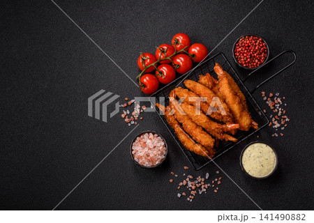 Shrimp or prawn tempura breaded with salt, spices and tartar sauce, Asian cuisine. Tempura shrimp Shrimp or prawn tempura breaded with salt, spices and tartar sauce, Asian cuisine. Tempura shrimp 141490882