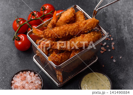 Shrimp or prawn tempura breaded with salt, spices and tartar sauce, Asian cuisine. Tempura shrimp Shrimp or prawn tempura breaded with salt, spices and tartar sauce, Asian cuisine. Tempura shrimp 141490884