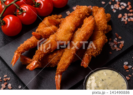 Shrimp or prawn tempura breaded with salt, spices and tartar sauce, Asian cuisine. Tempura shrimp Shrimp or prawn tempura breaded with salt, spices and tartar sauce, Asian cuisine. Tempura shrimp 141490886