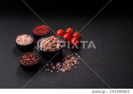 Fish, canned tuna chunks in brine for sandwiches and salads. Canned tuna Fish, canned tuna chunks in brine for sandwiches and salads. Canned tuna 141490903