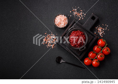 Grated beetroot with salt and spices as an ingredient for borscht or a vegan salad. Grated beetroot Grated beetroot with salt and spices as an ingredient for borscht or a vegan salad. Grated beetroot 141490945