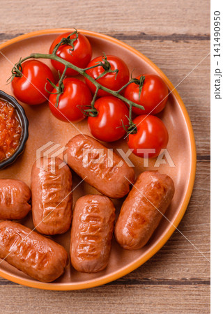 Chicken or pork grilling sausages with garlic, salt, and spices. Grilling sausages 141490950