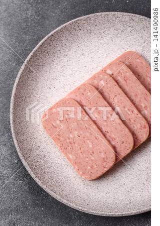 Canned spiced ham slices for holiday sandwiches. Ham slices Canned spiced ham slices for holiday sandwiches. Ham slices 141490986