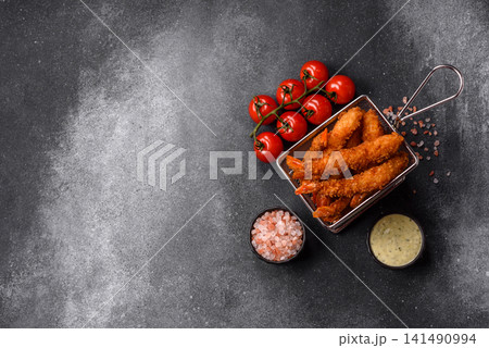 Shrimp or prawn tempura breaded with salt, spices and tartar sauce, Asian cuisine. Tempura shrimp Shrimp or prawn tempura breaded with salt, spices and tartar sauce, Asian cuisine. Tempura shrimp 141490994