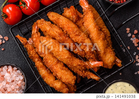 Shrimp or prawn tempura breaded with salt, spices and tartar sauce, Asian cuisine. Tempura shrimp Shrimp or prawn tempura breaded with salt, spices and tartar sauce, Asian cuisine. Tempura shrimp 141491038