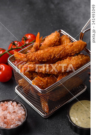 Shrimp or prawn tempura breaded with salt, spices and tartar sauce, Asian cuisine. Tempura shrimp Shrimp or prawn tempura breaded with salt, spices and tartar sauce, Asian cuisine. Tempura shrimp 141491049