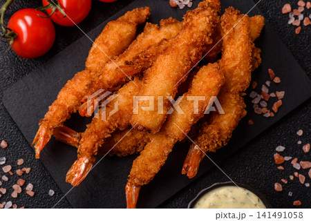 Shrimp or prawn tempura breaded with salt, spices and tartar sauce, Asian cuisine. Tempura shrimp Shrimp or prawn tempura breaded with salt, spices and tartar sauce, Asian cuisine. Tempura shrimp 141491058