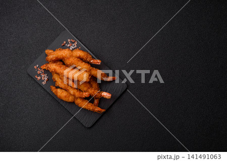 Shrimp or prawn tempura breaded with salt, spices and tartar sauce, Asian cuisine. Tempura shrimp Shrimp or prawn tempura breaded with salt, spices and tartar sauce, Asian cuisine. Tempura shrimp 141491063