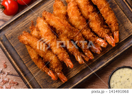 Shrimp or prawn tempura breaded with salt, spices and tartar sauce, Asian cuisine. Tempura shrimp Shrimp or prawn tempura breaded with salt, spices and tartar sauce, Asian cuisine. Tempura shrimp 141491068
