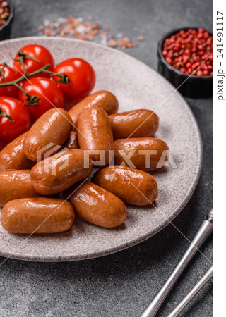Chicken or pork grilling sausages with garlic, salt, and spices. Grilling sausages 141491117