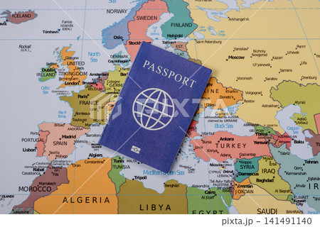 International passport against a map backdrop, concepts of travel. Passport on a map 141491140
