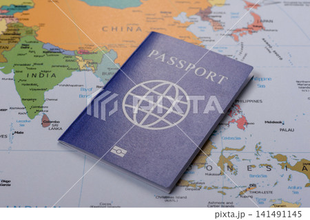 International passport against a map backdrop, concepts of travel. Passport on a map 141491145