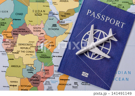 International passport against a map backdrop, concepts of travel. Passport on a map International passport against a map backdrop, concepts of travel. Passport on a map 141491149