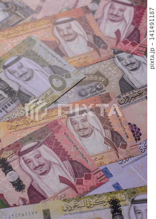 Saudi Arabia paper money, riyal banknotes and coins as currency for exchange. Saudi Arabia money Saudi Arabia paper money, riyal banknotes and coins as currency for exchange. Saudi Arabia money 141491187