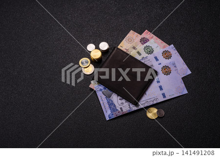 Saudi Arabia paper money, riyal banknotes and coins as currency for exchange. Saudi Arabia money Saudi Arabia paper money, riyal banknotes and coins as currency for exchange. Saudi Arabia money 141491208