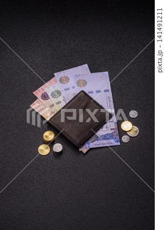 Saudi Arabia paper money, riyal banknotes and coins as currency for exchange. Saudi Arabia money Saudi Arabia paper money, riyal banknotes and coins as currency for exchange. Saudi Arabia money 141491211