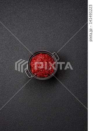 Grated beetroot with salt and spices as an ingredient for borscht or a vegan salad. Grated beetroot Grated beetroot with salt and spices as an ingredient for borscht or a vegan salad. Grated beetroot 141491223