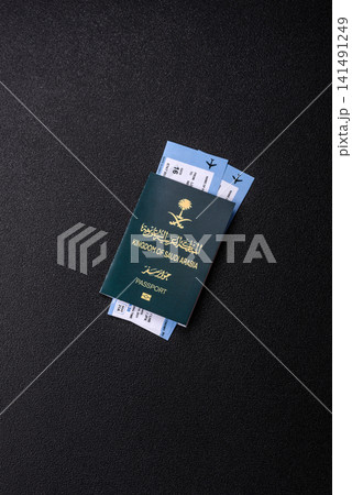 Saudi Arabia passport or id document with tickets for flight, travel. Saudi Arabia passport 141491249