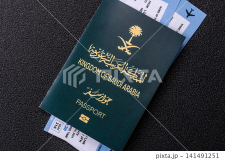 Saudi Arabia passport or id document with tickets for flight, travel. Saudi Arabia passport Saudi Arabia passport or id document with tickets for flight, travel. Saudi Arabia passport 141491251