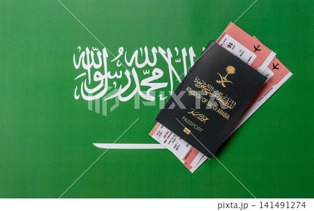 Saudi Arabia passport or id document with tickets for flight, travel. Saudi Arabia passport Saudi Arabia passport or id document with tickets for flight, travel. Saudi Arabia passport 141491274
