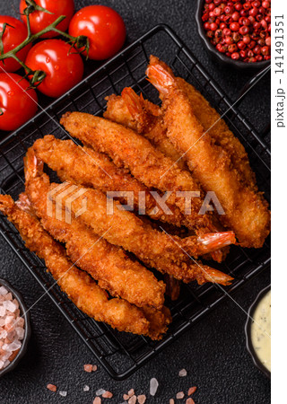 Shrimp or prawn tempura breaded with salt, spices and tartar sauce, Asian cuisine. Tempura shrimp Shrimp or prawn tempura breaded with salt, spices and tartar sauce, Asian cuisine. Tempura shrimp 141491351