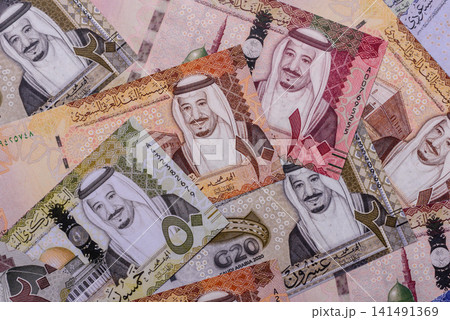 Saudi Arabia paper money, riyal banknotes and coins as currency for exchange. Saudi Arabia money Saudi Arabia paper money, riyal banknotes and coins as currency for exchange. Saudi Arabia money 141491369