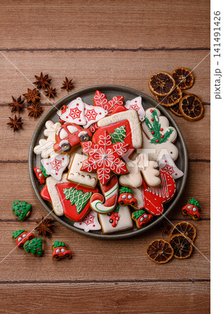 Gingerbread as a Christmas staple, sweet biscuits for the holiday table. Gingerbread as a backdrop Gingerbread as a Christmas staple, sweet biscuits for the holiday table. Gingerbread as a backdrop 141491426