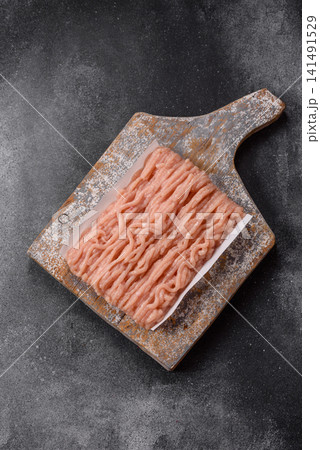 Fresh raw ground chicken, poultry meat for home cooking. Ground chicken Fresh raw ground chicken, poultry meat for home cooking. Ground chicken 141491529
