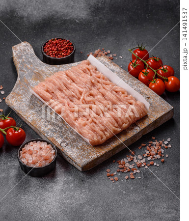 Fresh raw ground chicken, poultry meat for home cooking. Ground chicken Fresh raw ground chicken, poultry meat for home cooking. Ground chicken 141491537